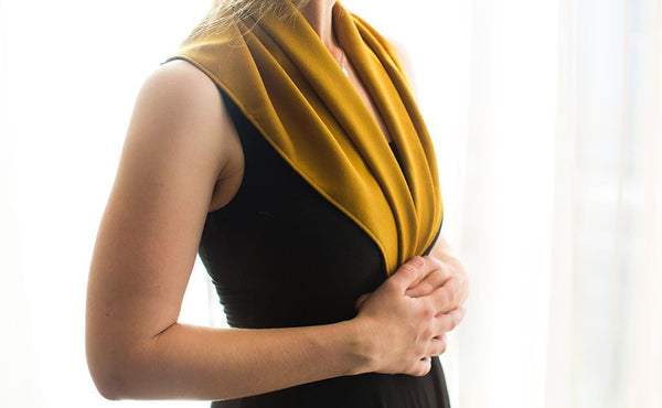 A person using the Shepherd's Wool Utility Cloth as a shawl.